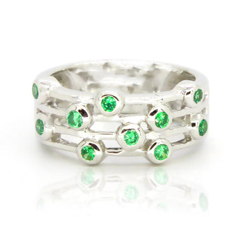 Whimsical sterling silver ring featuring green topaz with a bezel design