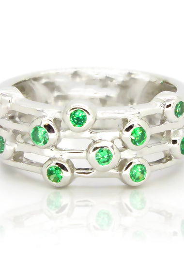 Sterling silver ring with green round gemstones in stacked row setting