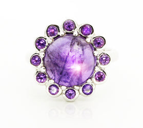 Sterling silver ring with round amethyst cabochon and purple halo stones