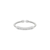 Sterling silver cuff ring with textured band and clear CZ center row