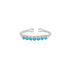 Sterling silver cuff ring with turquoise bezel stones