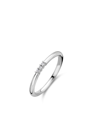 Sterling silver three-stone CZ ring with three small clear stones on a slim band