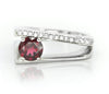 Sterling silver split-shank ring with red round garnet and pavé side stones