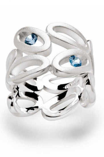 Symmetrical Sterling Silver ovals forming a ring set with blue topaz stones