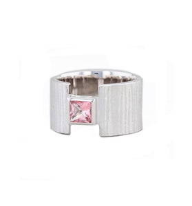 Textured sterling silver set with a pink topaz stone