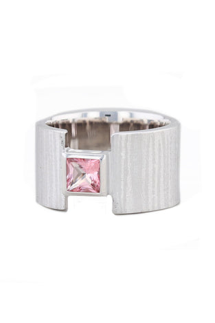 Textured sterling silver set with a pink topaz stone