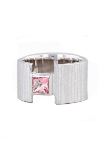 Textured sterling silver set with a pink topaz stone