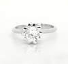 Sterling silver ring with round white topaz center and flowerlike prongs